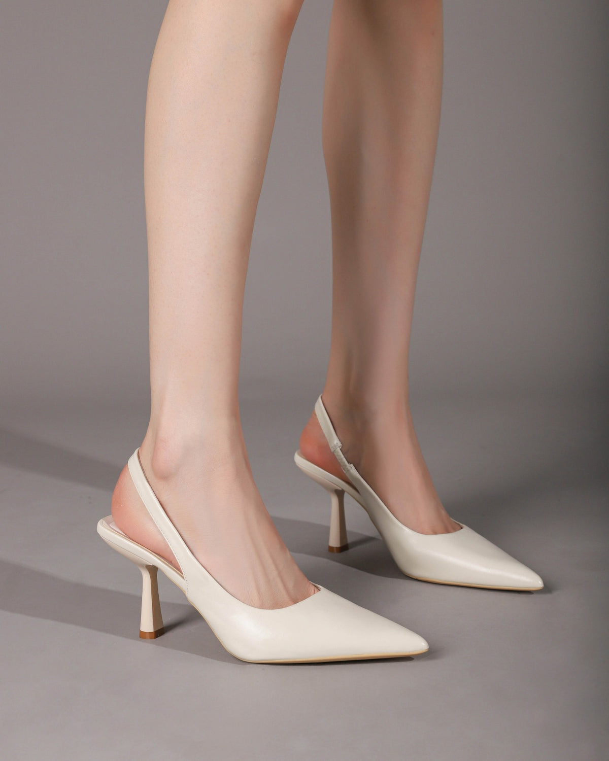 Off-White slingback heels on foot