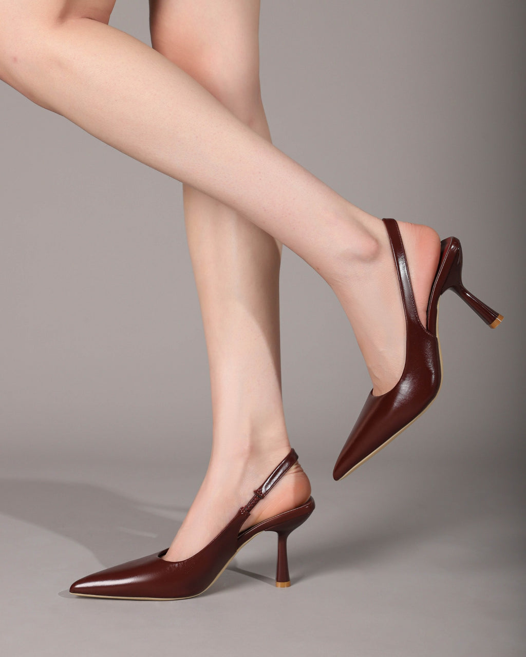 Wine Red slingback heels on foot