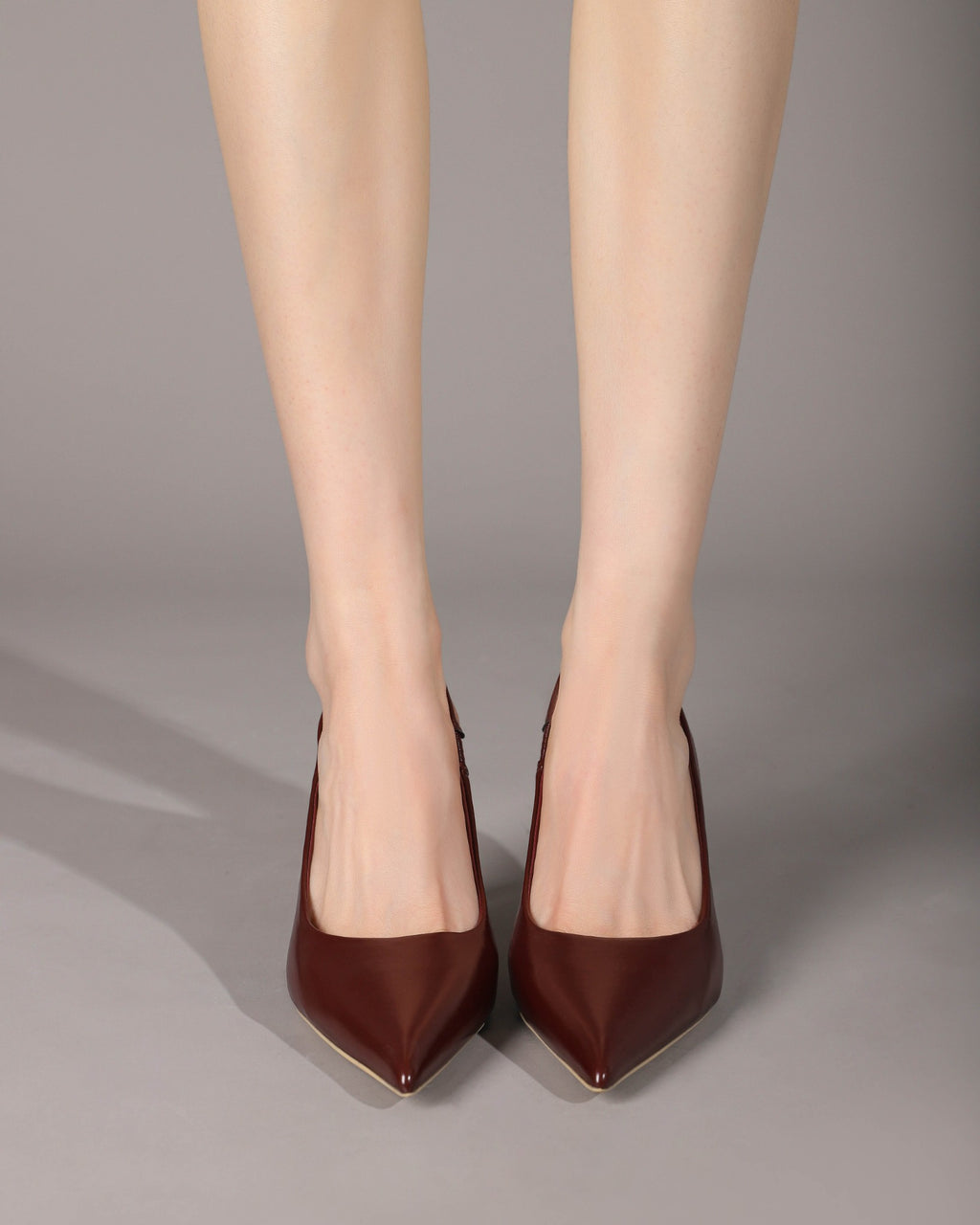 Wine Red slingback pumps seated on-foot view
