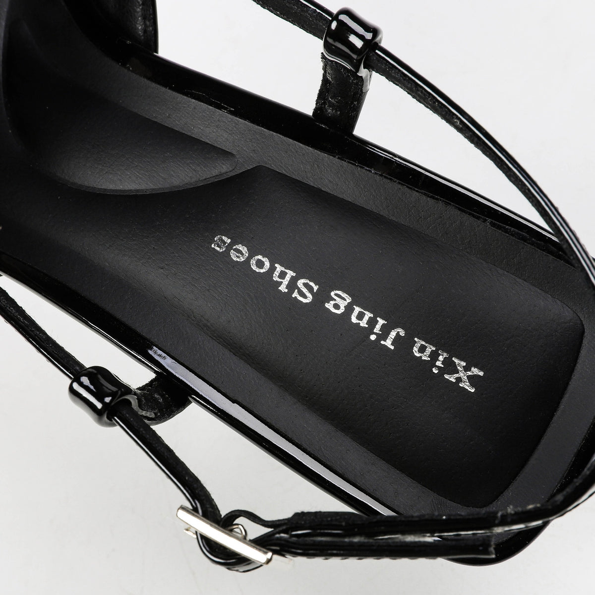 Black patent slingback pumps detail view 2