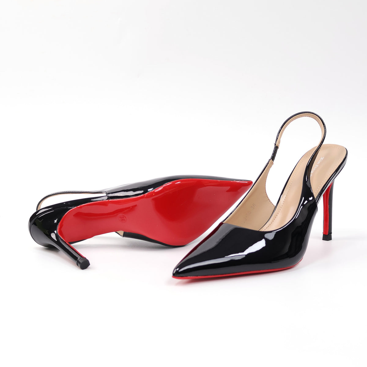 Black pointed-toe patent slingback stiletto pumps