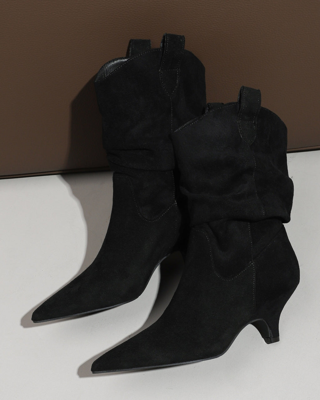 Black pointed toe slouchy fabric ankle boots view 1