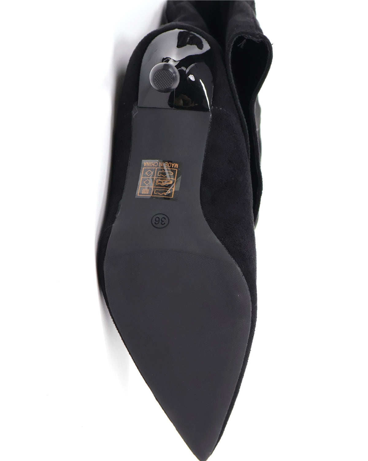 Black pointed-toe slouch stiletto knee-high boots outsole detail