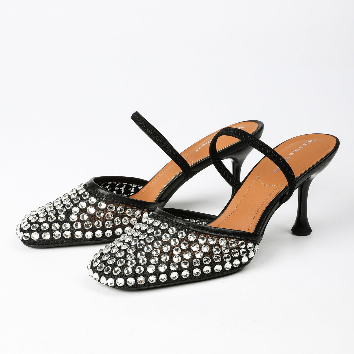 Black rhinestone mesh heeled mules, pair on white background