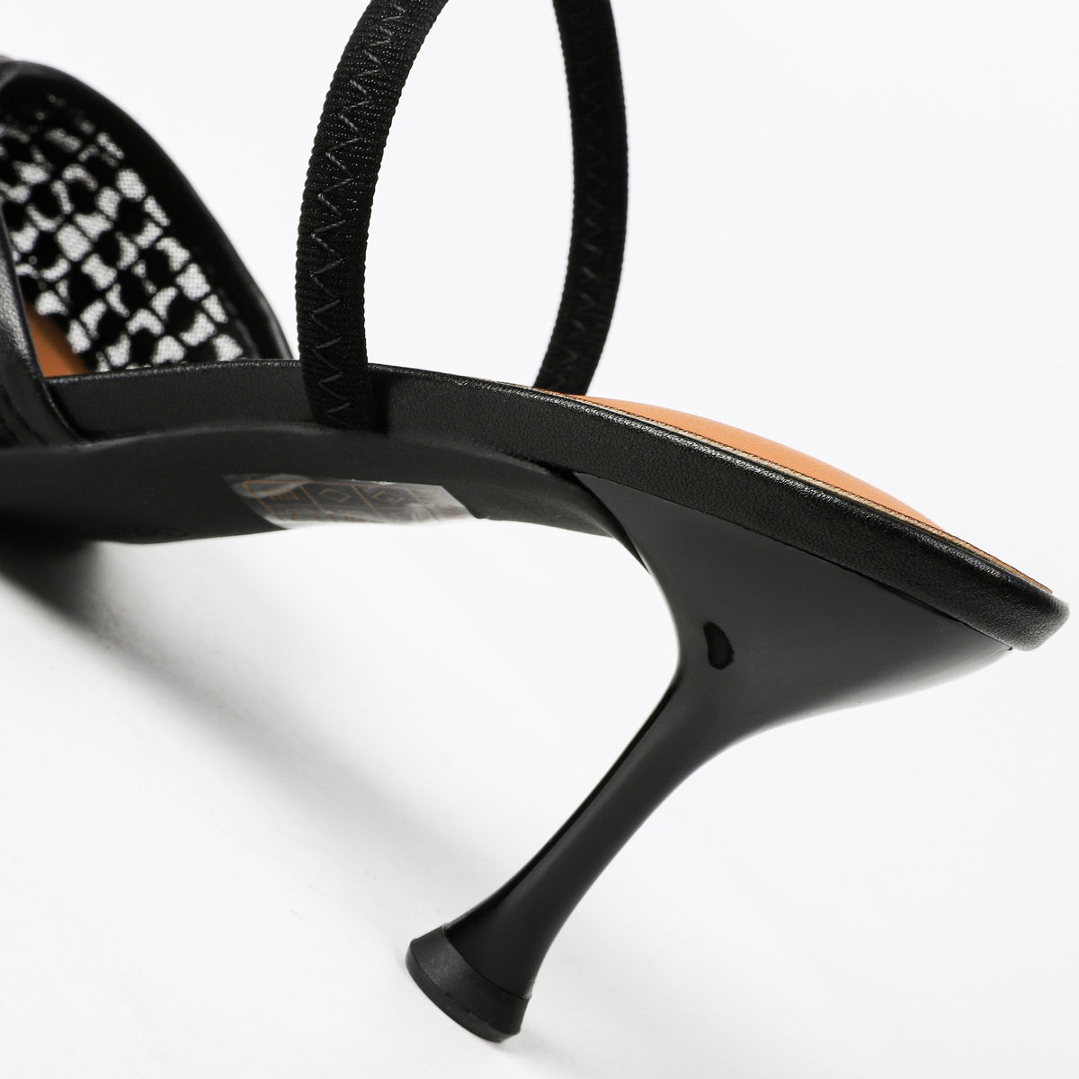Black mule narrow sculpted heel detail