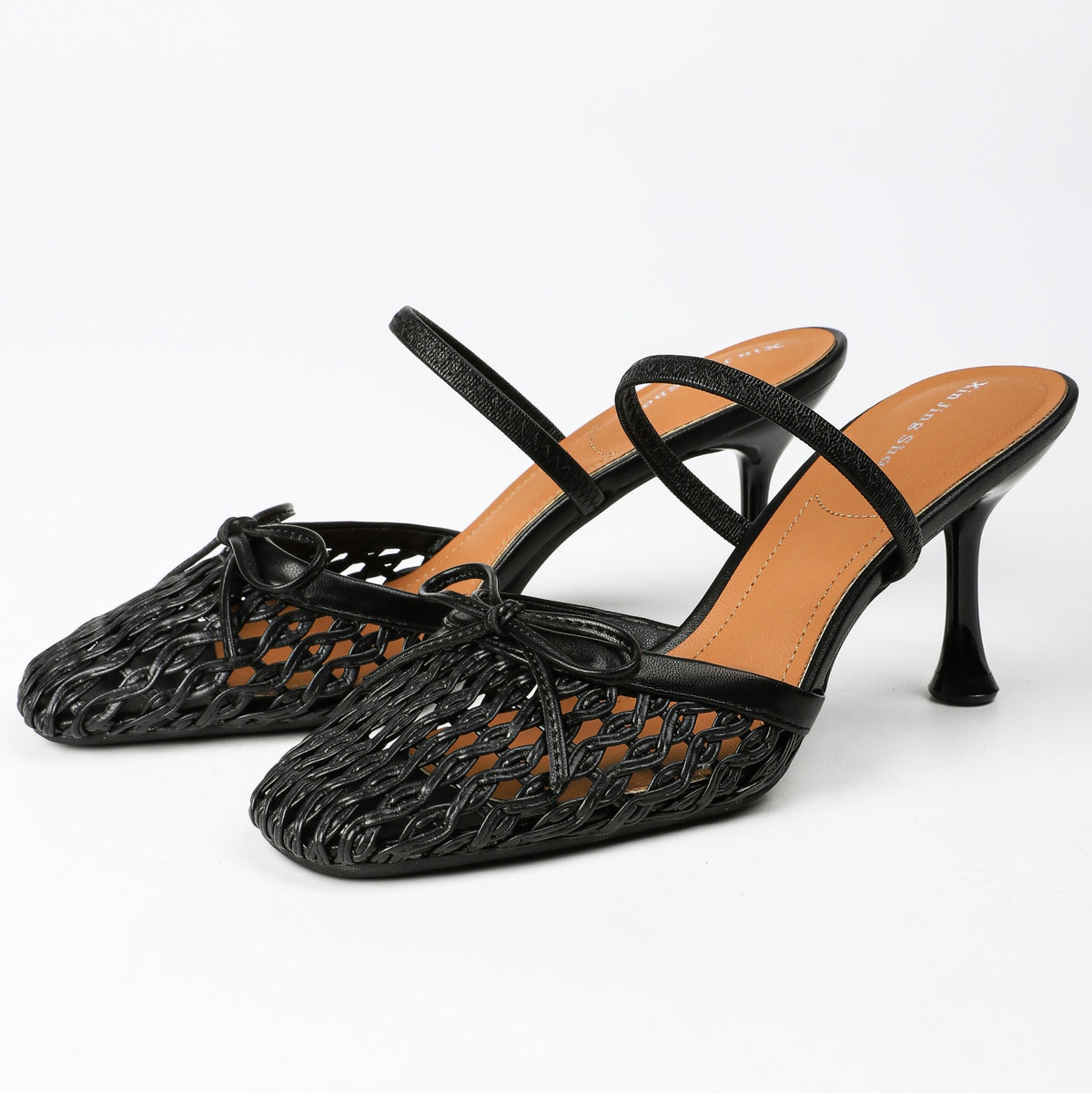 Black woven bow square-toe heeled mules, pair front view