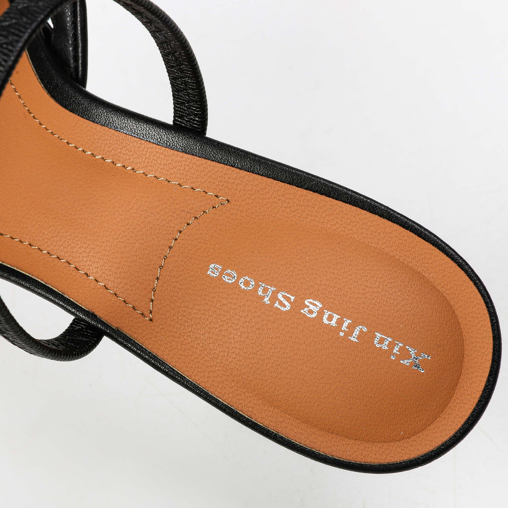 Black heeled mule footbed detail