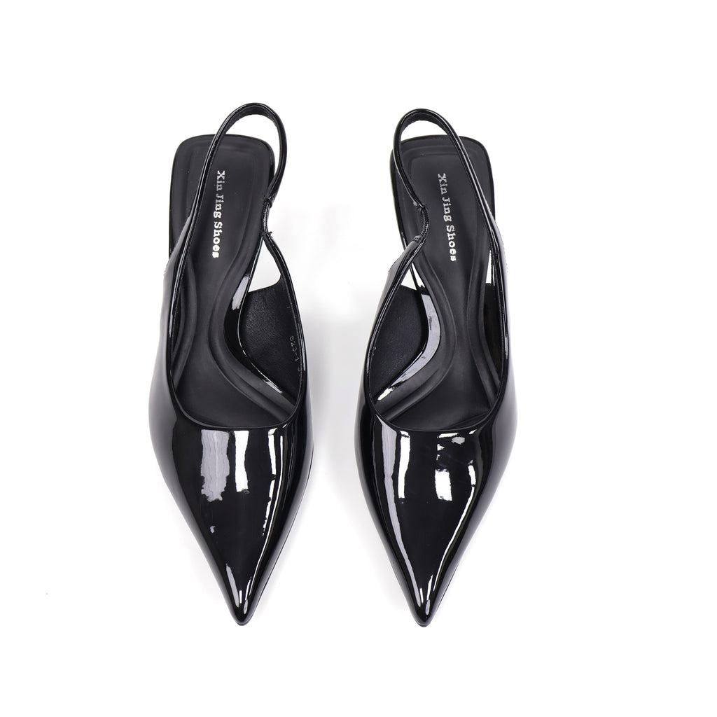 Black pointed-toe patent slingback pumps