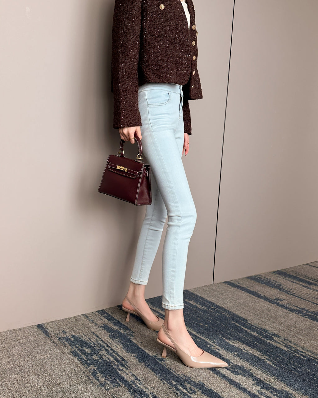 Khaki pointed-toe patent slingback pumps on foot