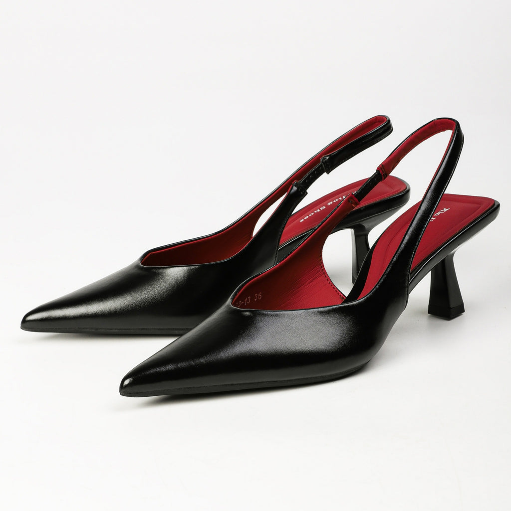 Black pointed-toe slingback heels pair front three-quarter view