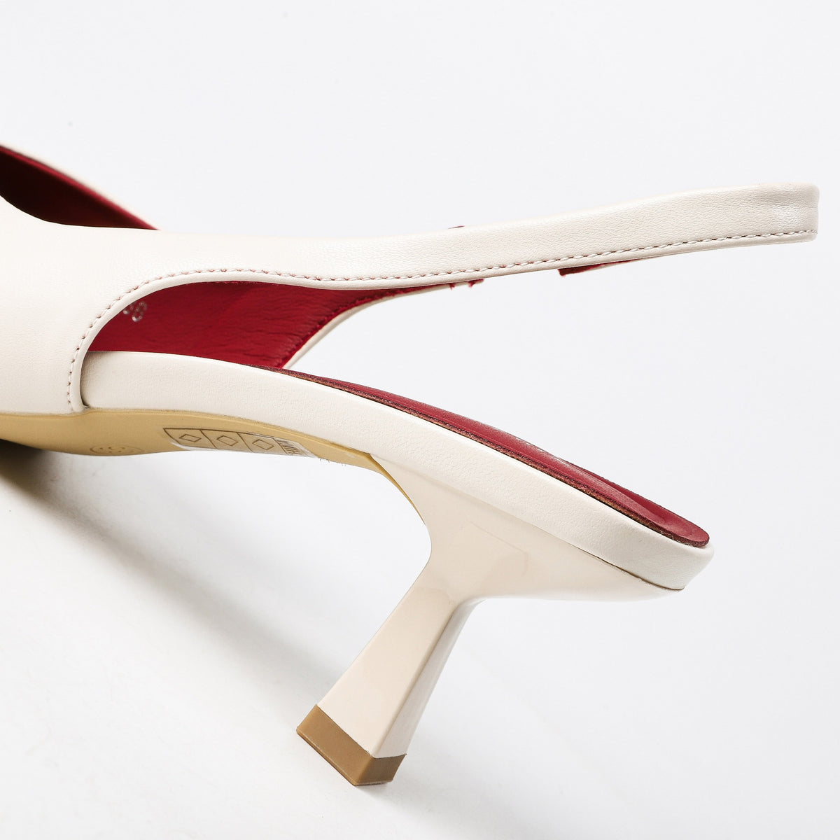Off-white slingback heel strap stitching and flared heel detail