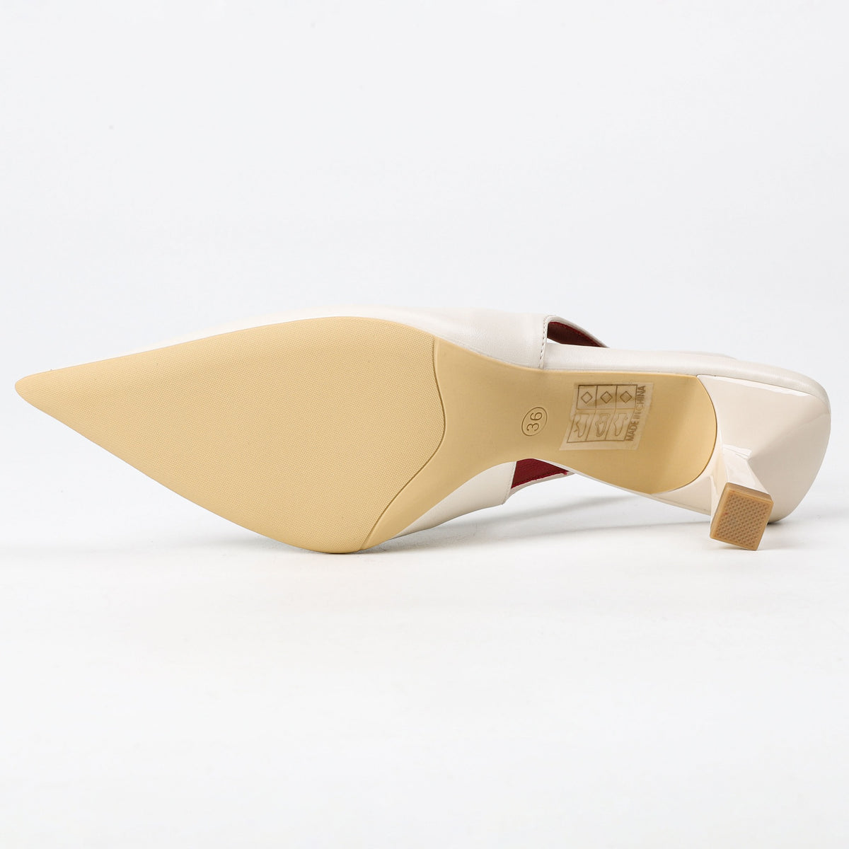 Off-white pointed-toe slingback heel outsole view