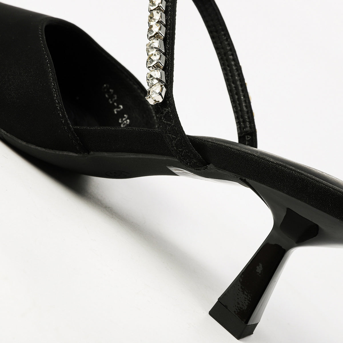 Black rhinestone strap and heel detail