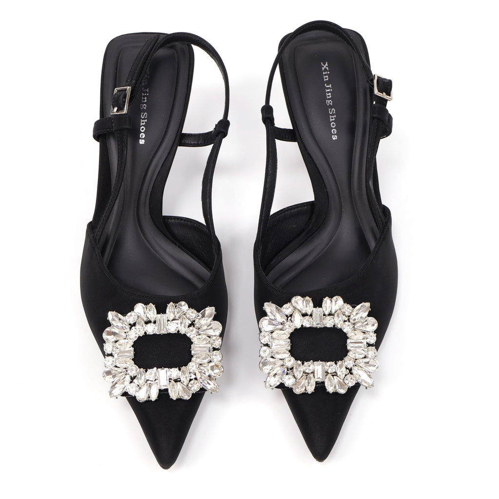 Black pointed-toe crystal buckle slingback heels