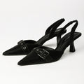 Black pointed-toe buckle slingback heels, pair front three-quarter view