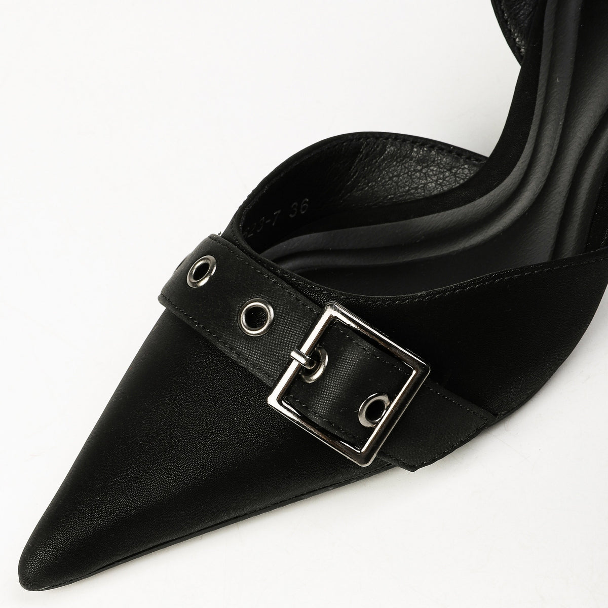 Black buckle strap and silver eyelet close-up
