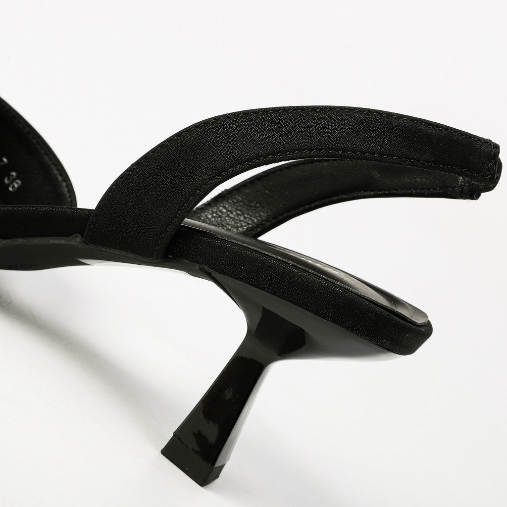 Black slingback strap and flared heel detail