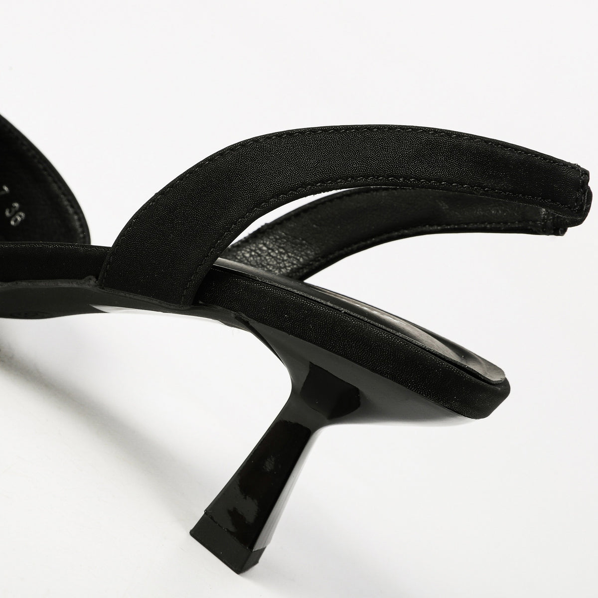Black slingback strap and flared heel detail