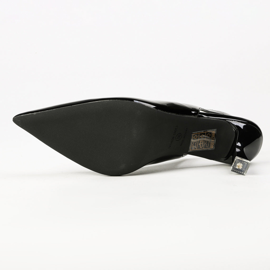 Black patent pointed-toe slingback heel sole detail
