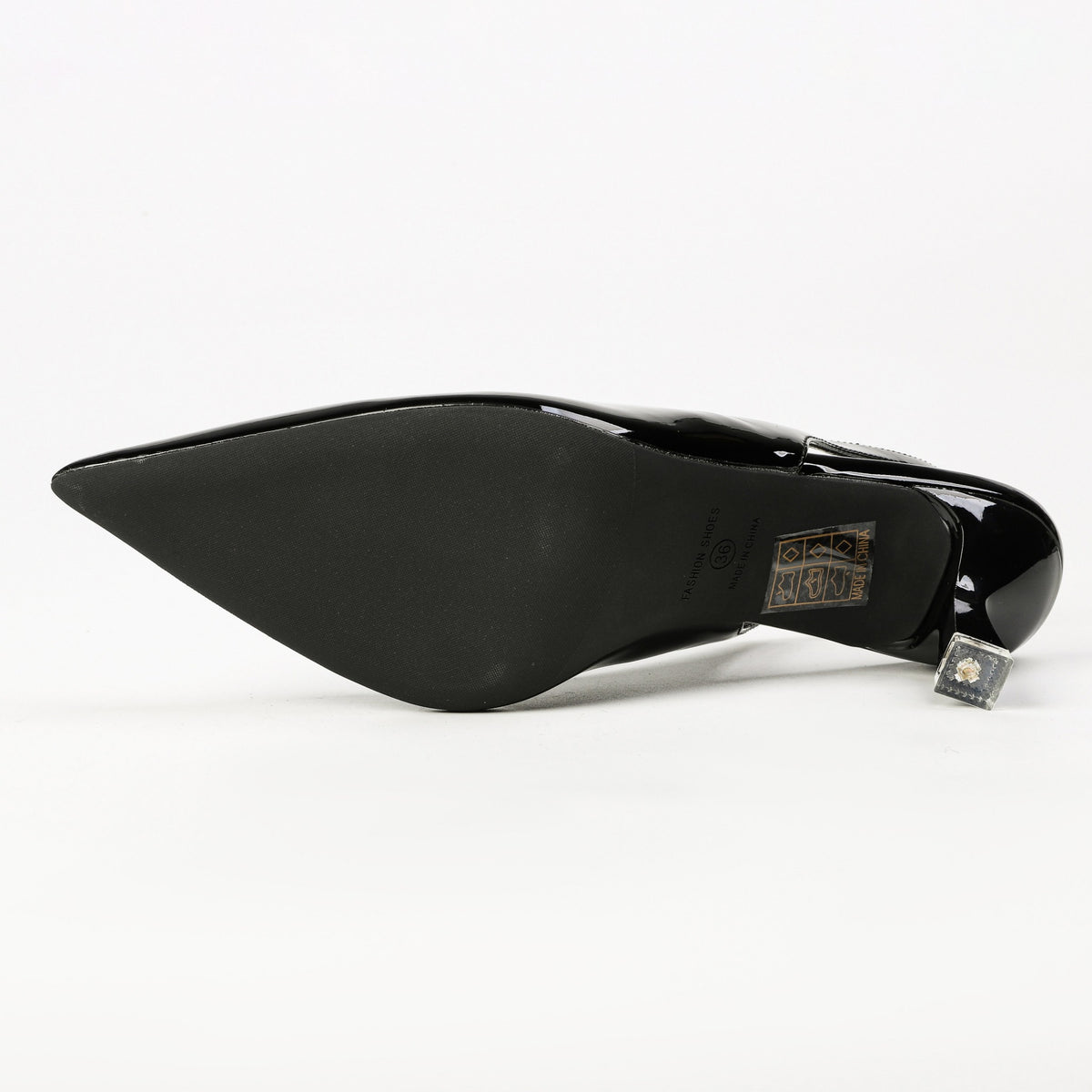 Black patent pointed-toe slingback heel sole detail