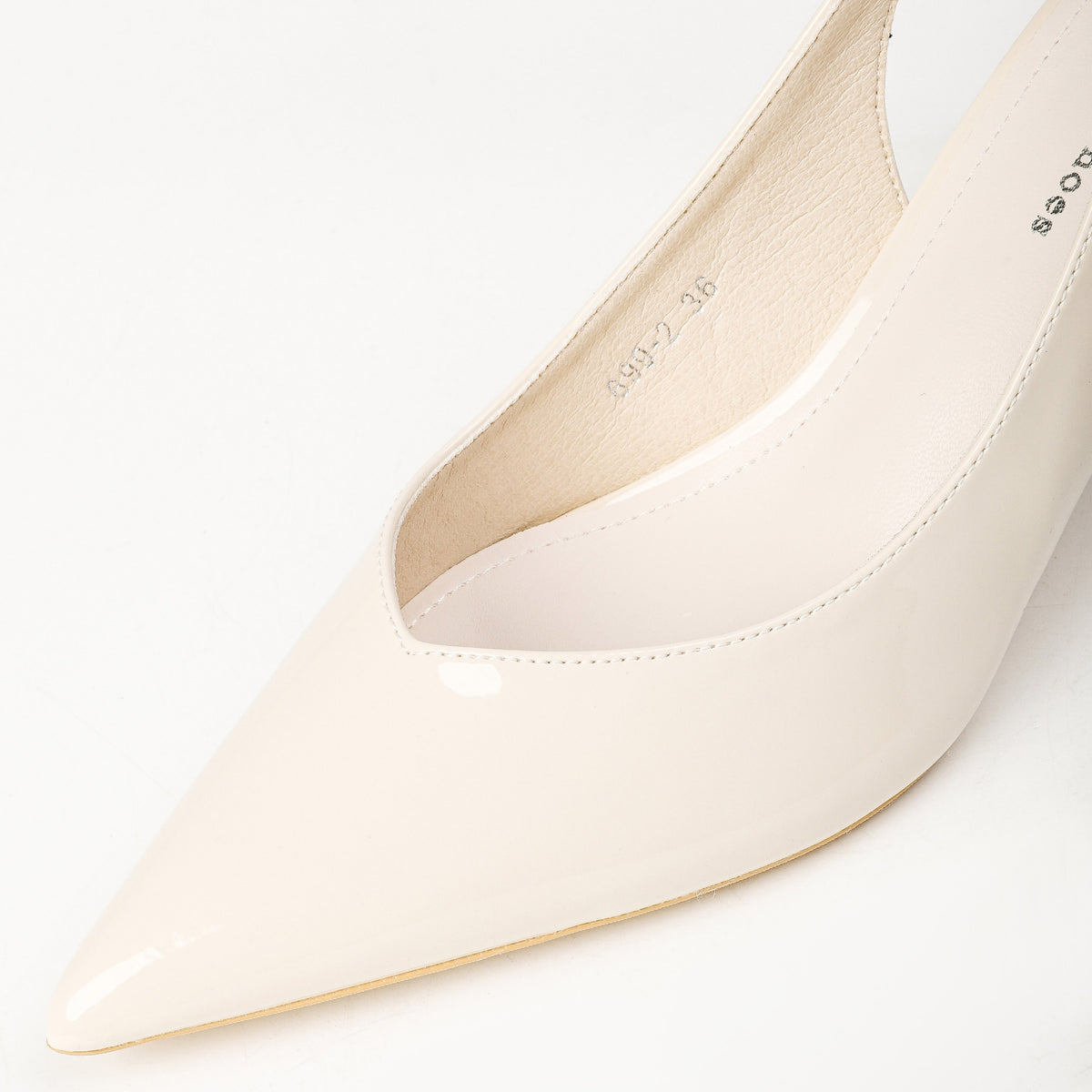 Cream patent slingback heel pointed toe detail