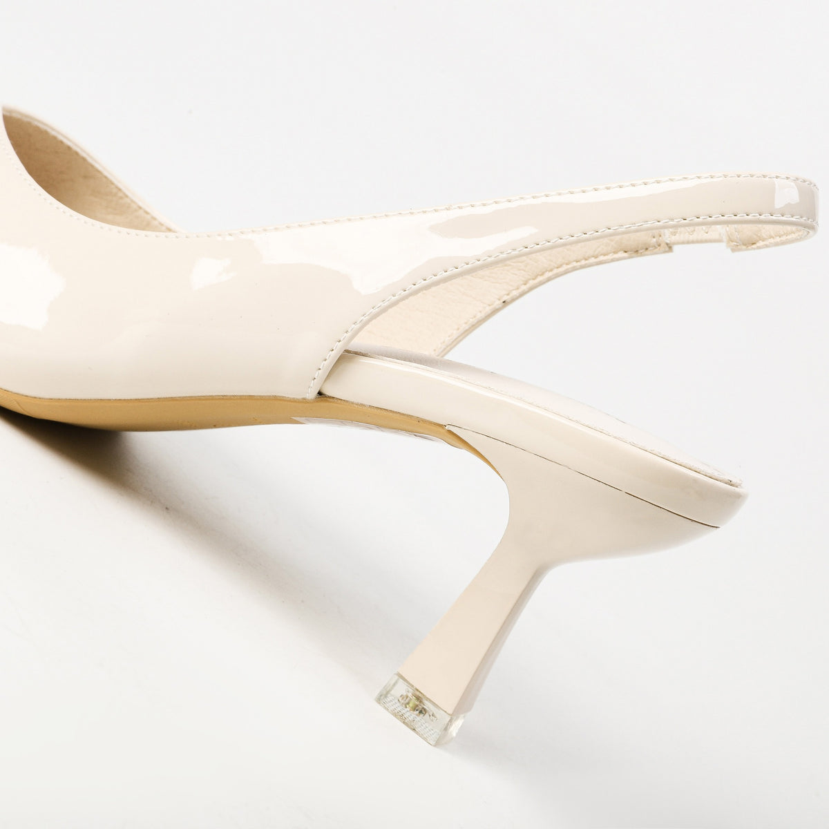 Cream patent slingback heel back strap detail