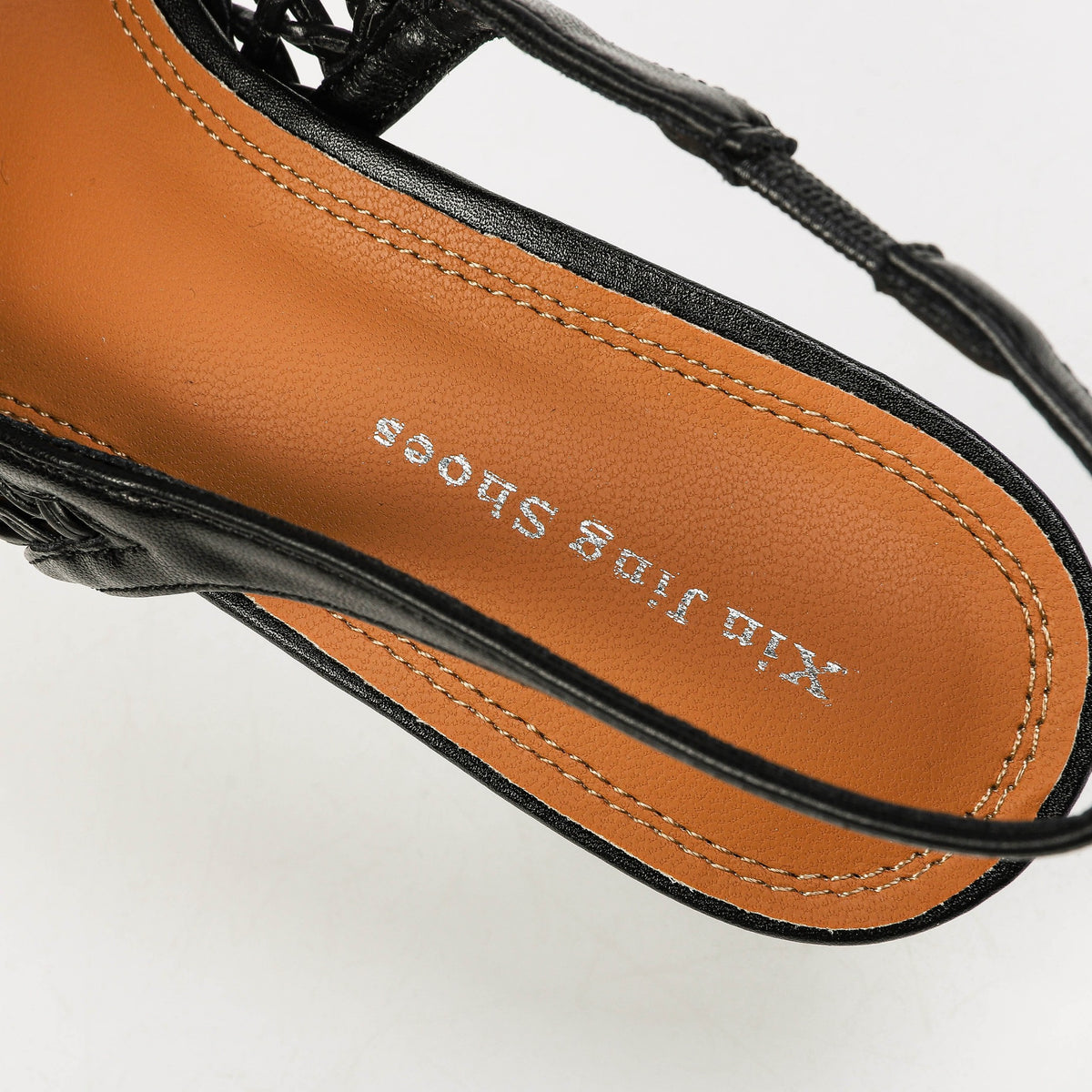Black slingback insole and strap close-up