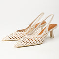 Off-white pointed-toe woven slingback heels pair front angle