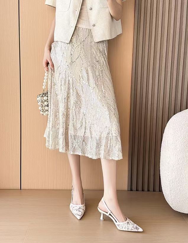 Off-white lace slingback heels worn standing pose