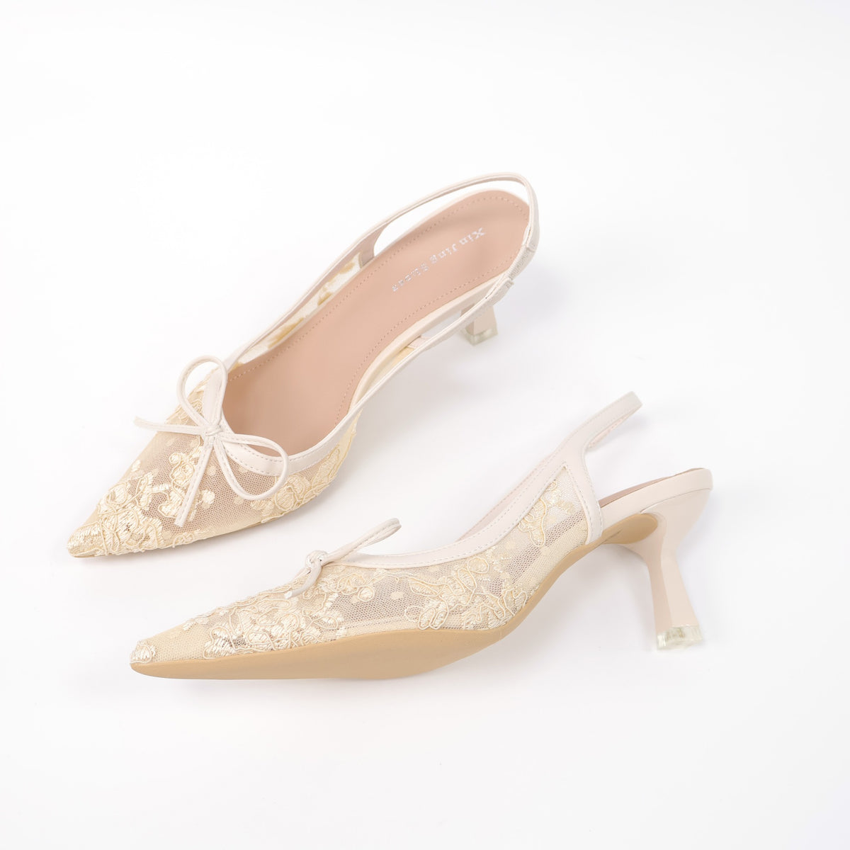 Off-white pointed-toe embroidered mesh slingback pumps angled view