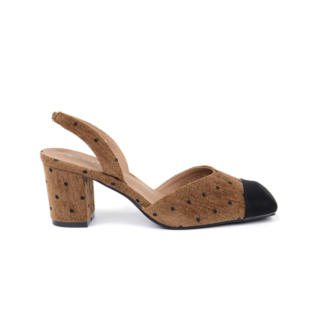 Brown cap-toe polka-dot slingback heels pair front detail