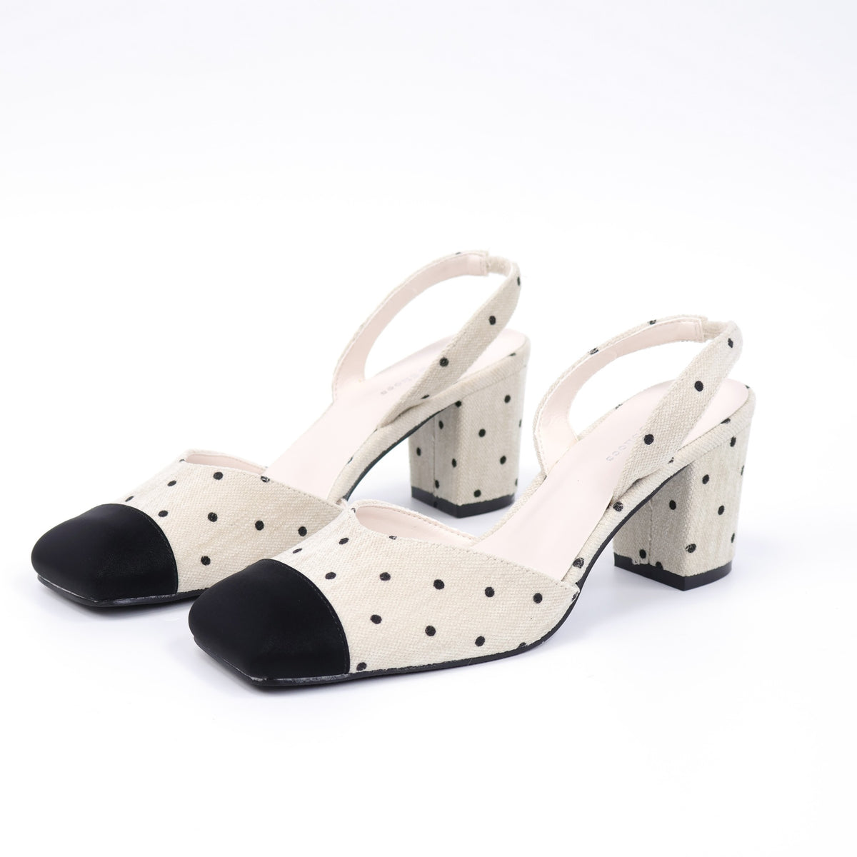 Off-white square-toe polka-dot fabric slingback heels pair front angle