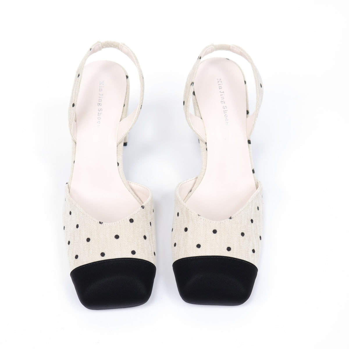 Off-white polka-dot slingback heels top view