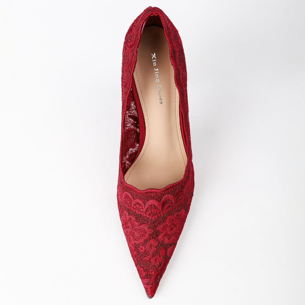 Red floral lace pumps top view