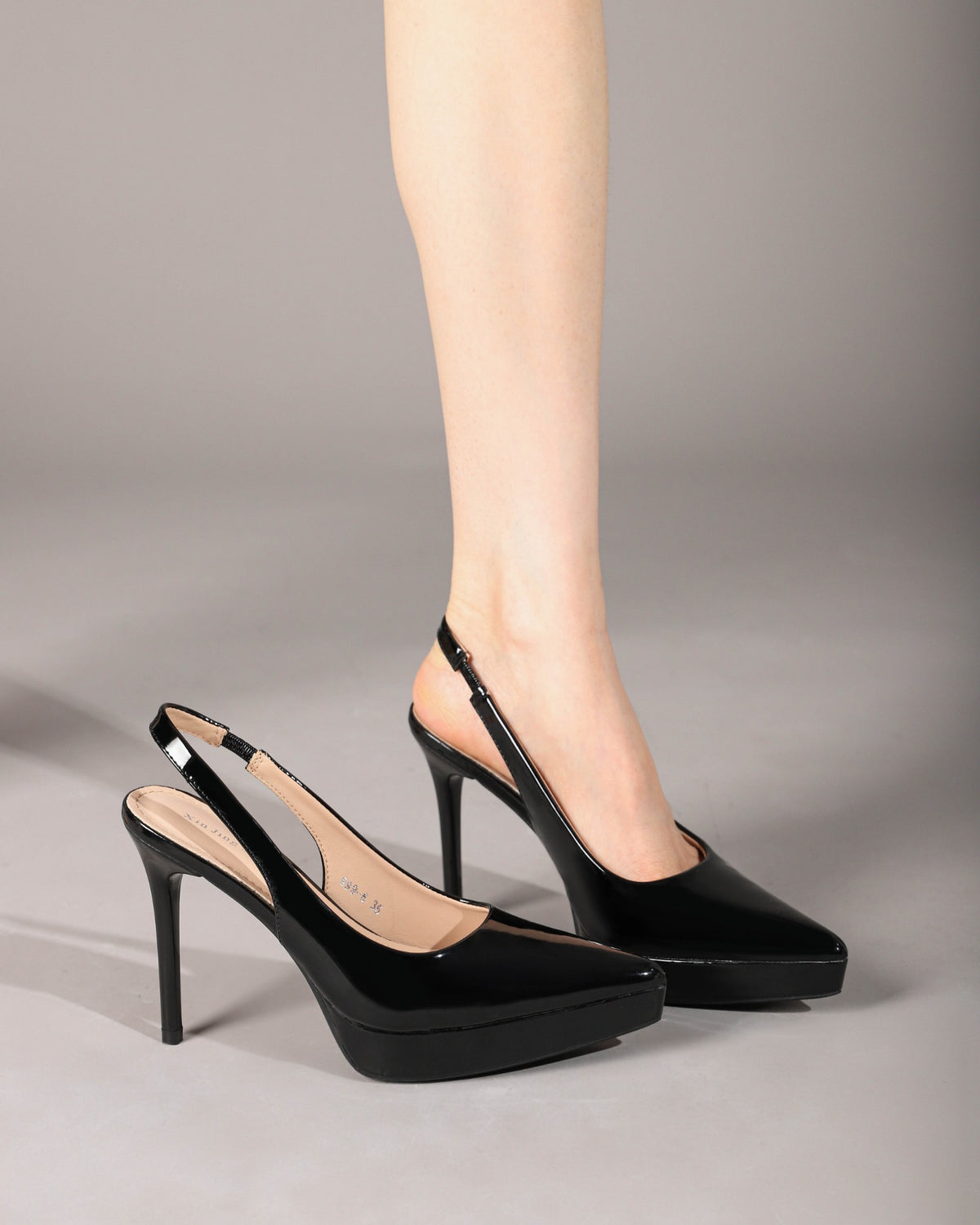 Black slingback pumps on foot