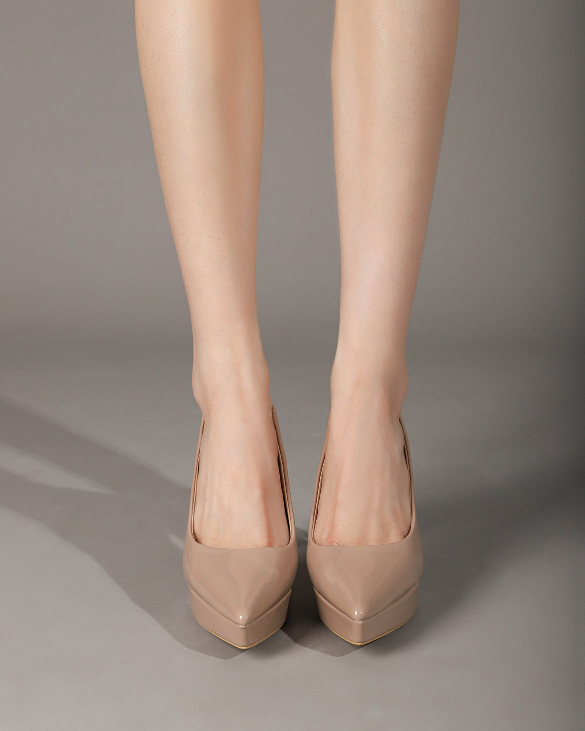 Khaki platform slingback pumps on foot