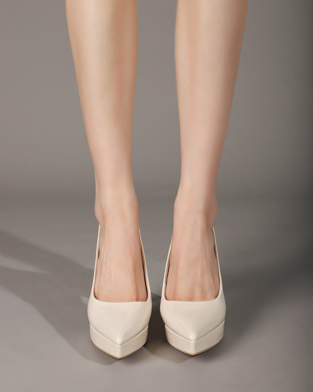 Off-white slingback pumps seated on-foot view