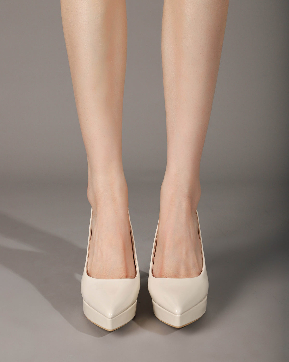 Off-white slingback pumps seated on-foot view