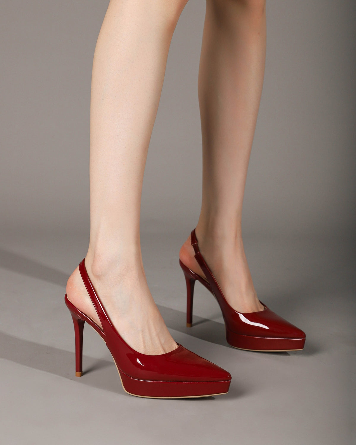 Wine Red slingback stiletto pumps on foot